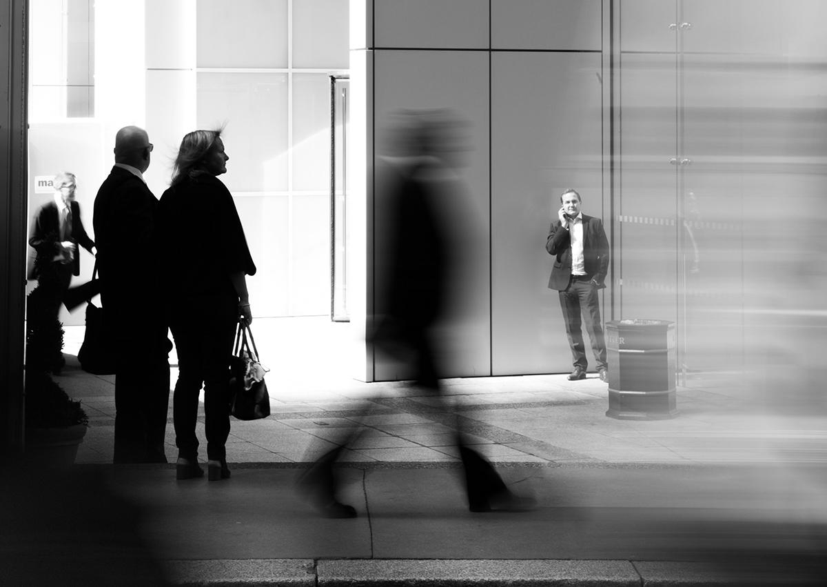 People walking in front an office building